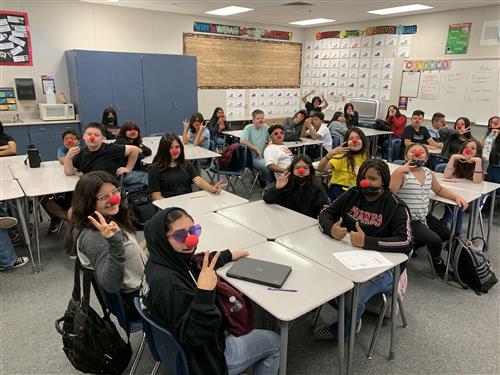 Students wear clown noses
